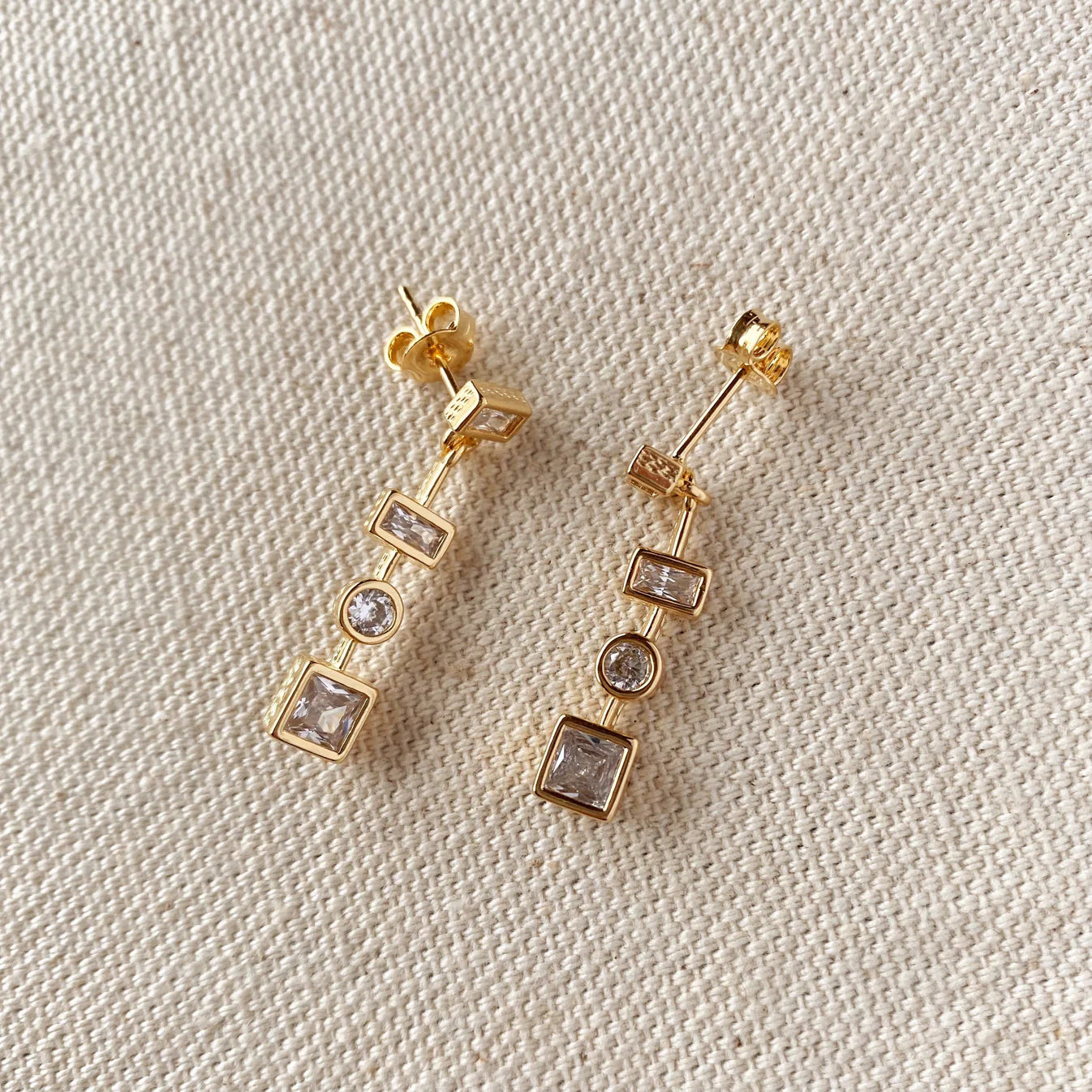 https://shopupstatethreads.com/cdn/shop/files/18k-Gold-Filled-Clear-Dangling-Shapes-Earring-3.webp?v=1686748754